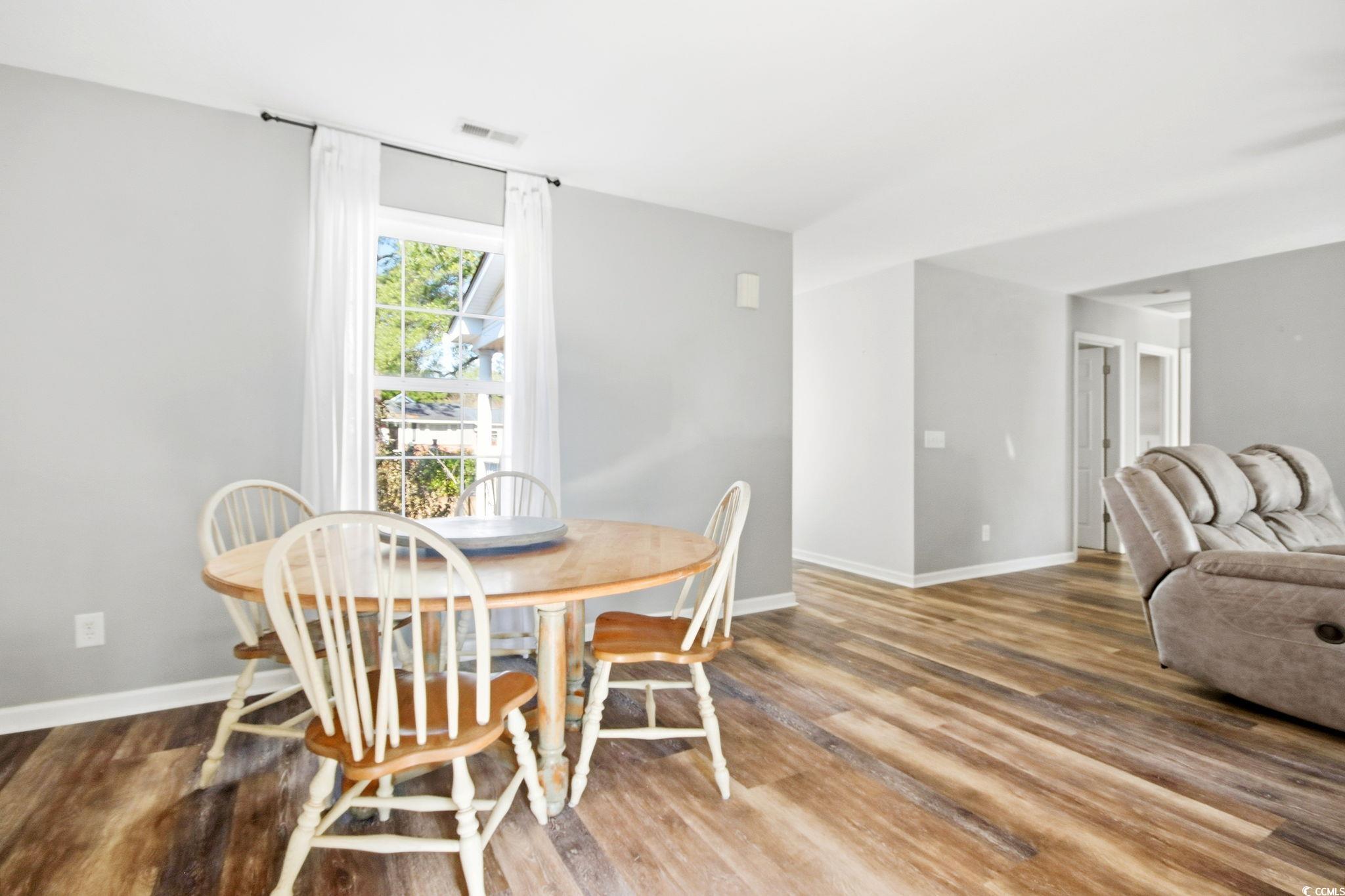 1735 Rice Street Georgetown, SC 29440 - Photo 8 of 34 Dining area featuring wood finished floors