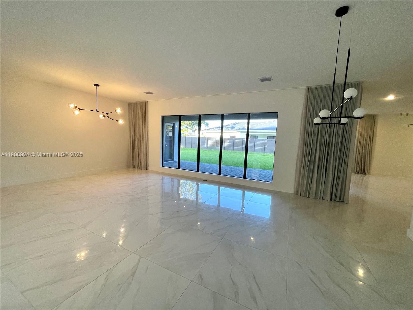 11181 Southwest 92nd Avenue, Unit 11181 Miami, FL 33176 - Photo 40 of 47 a view of a room with sliding glass door