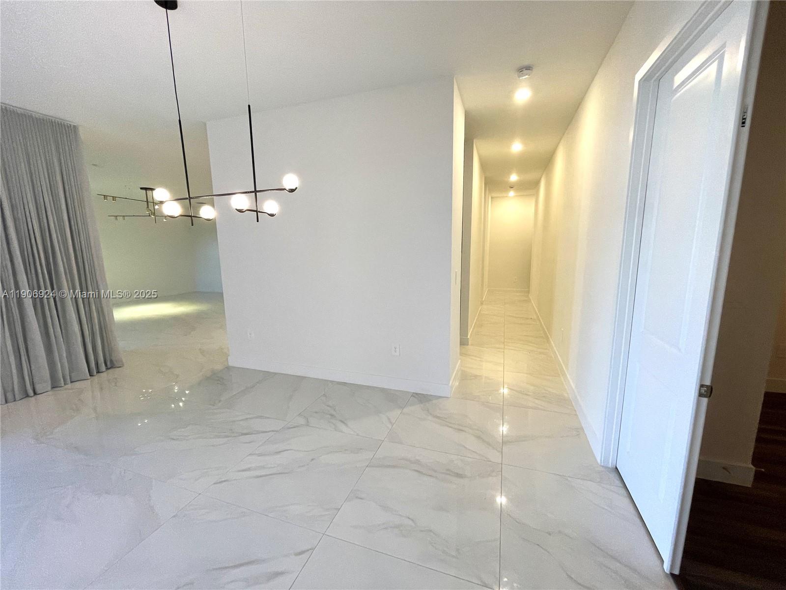 11181 Southwest 92nd Avenue, Unit 11181 Miami, FL 33176 - Photo 8 of 47 a view of a hallway with wooden floor