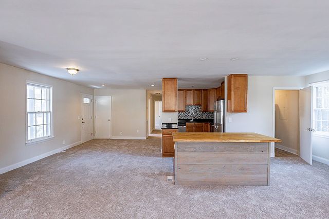 a view of a kitchen with furniture and a window