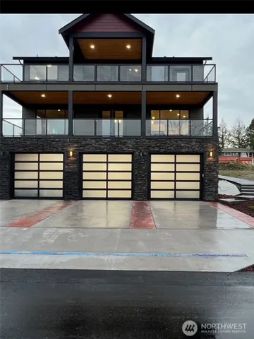 an aerial view of a house with a lake view