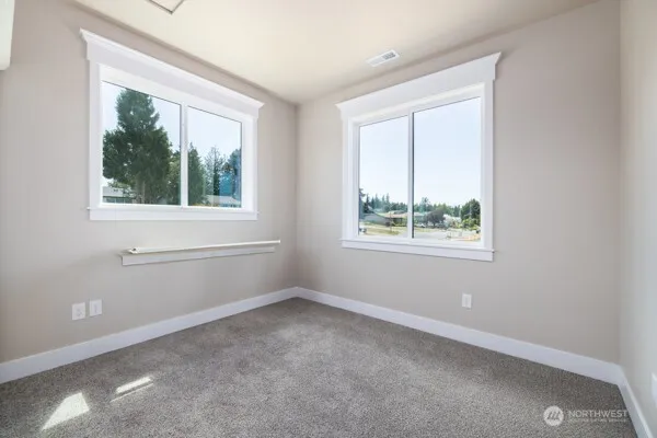 a front view of a building with a garden