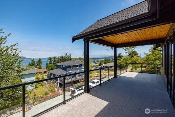 a bathroom with a large tub sink and mirror