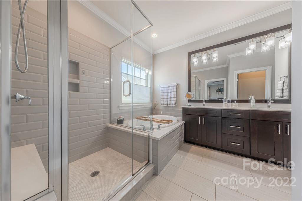 958 Emory Lane Fort Mill, SC 29708 - Photo 32 of 45 a bathroom with a tub sink shower and mirror