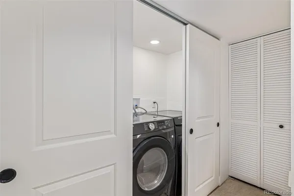 a view of bathroom with washer and dryer