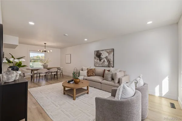 a living room with furniture and a table