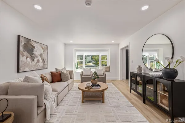 a living room with furniture and a large window