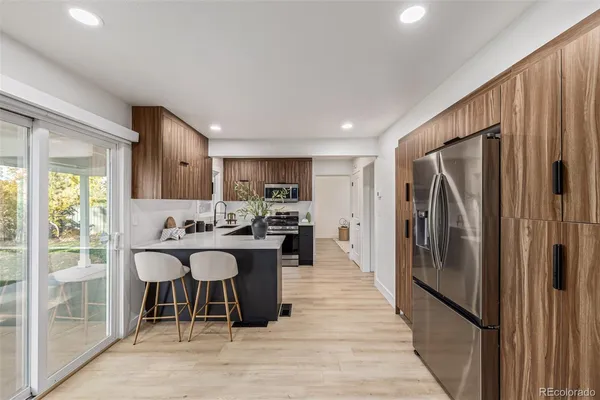 a kitchen with a table and chairs