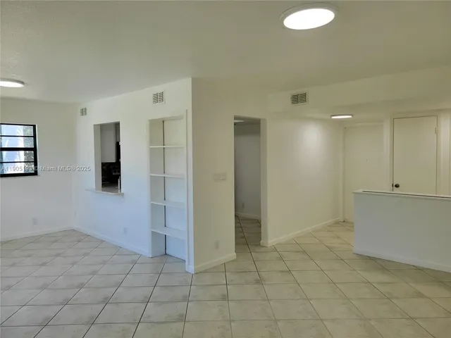 a bathroom with a toilet and a bath tub