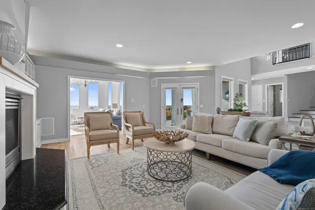 a living room with furniture or couch and a wooden floor