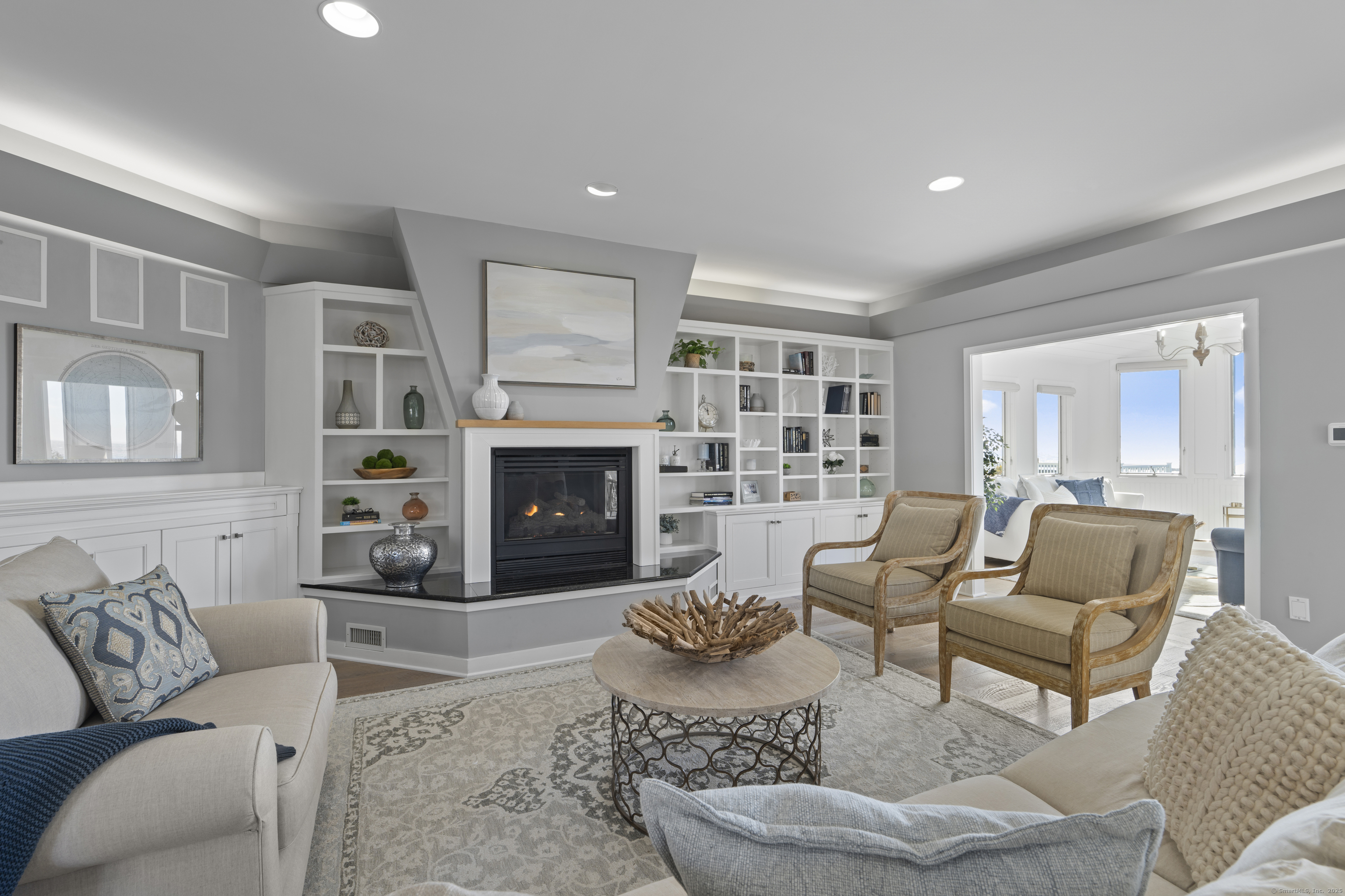 372 Maple Avenue Old Saybrook, CT 06475 - Photo 14 of 40 a living room with furniture and a fireplace