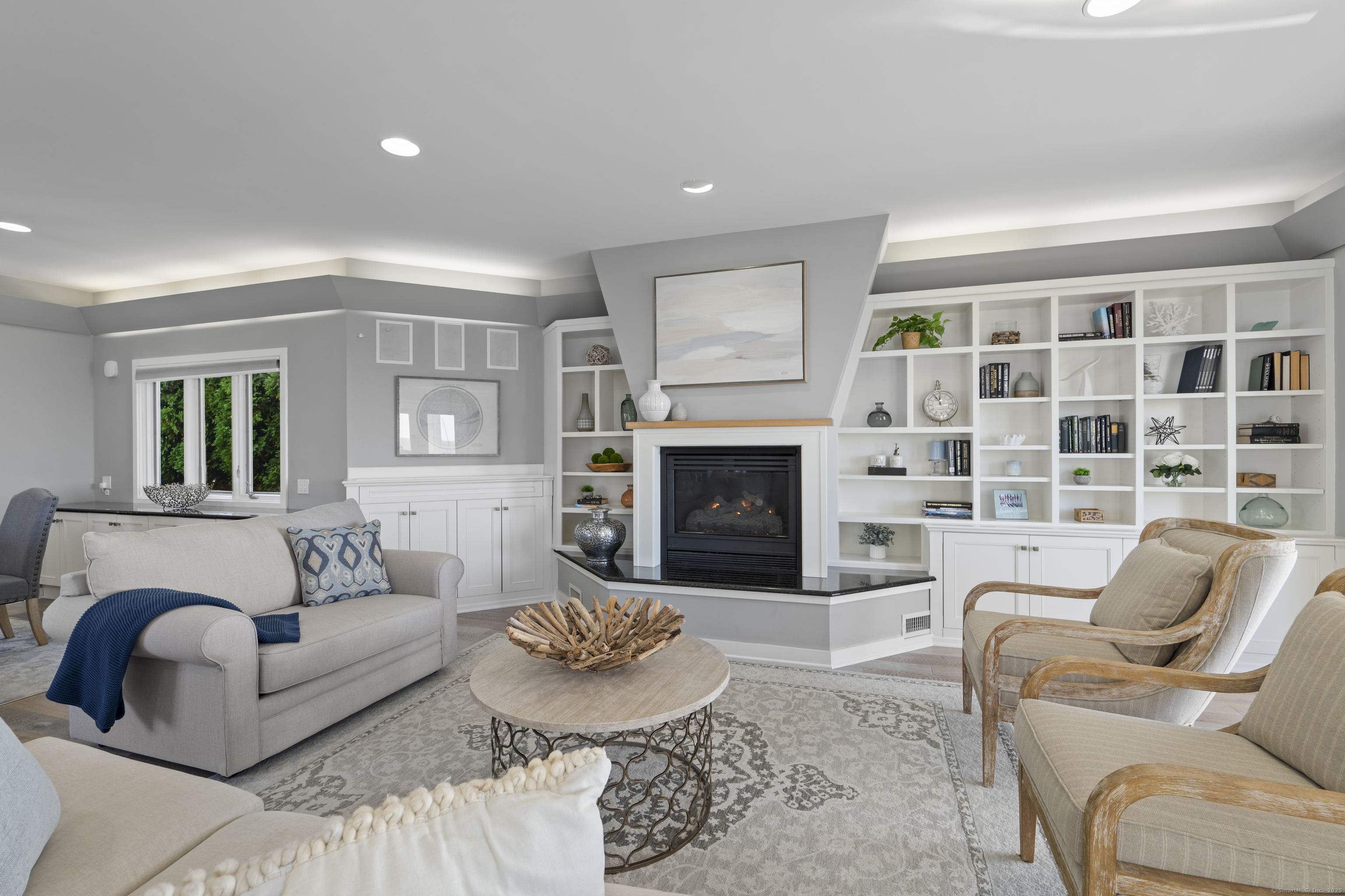 372 Maple Avenue Old Saybrook, CT 06475 - Photo 15 of 40 a living room with furniture and a fireplace