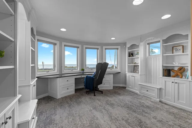 a workspace with furniture and window