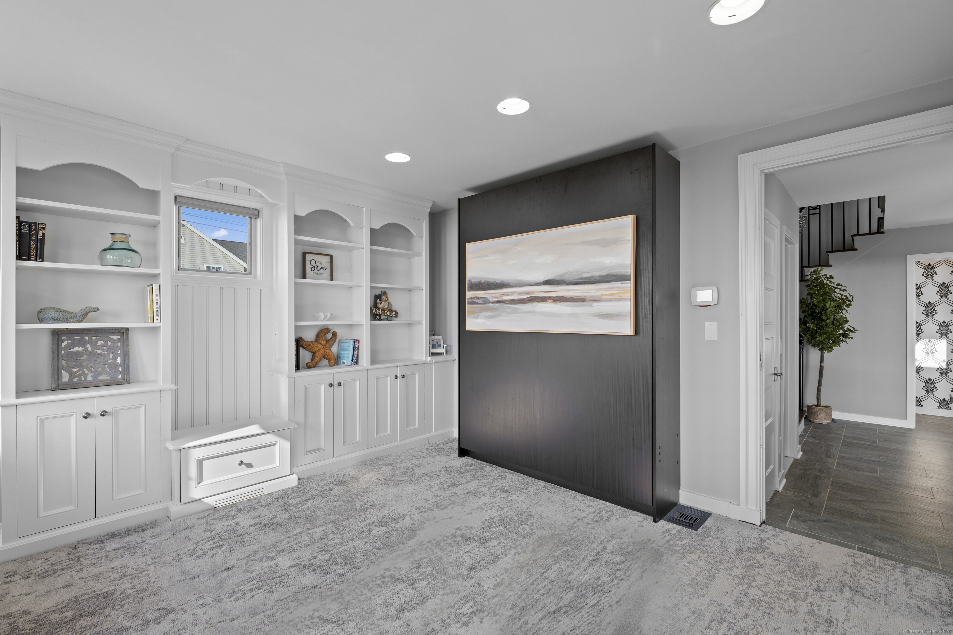 372 Maple Avenue Old Saybrook, CT 06475 - Photo 21 of 40 a view of livingroom with hardwood floor and cabinet