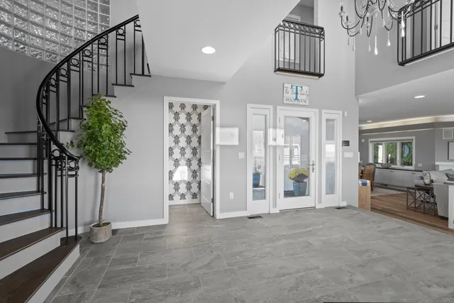 a view of an entryway with wooden floor