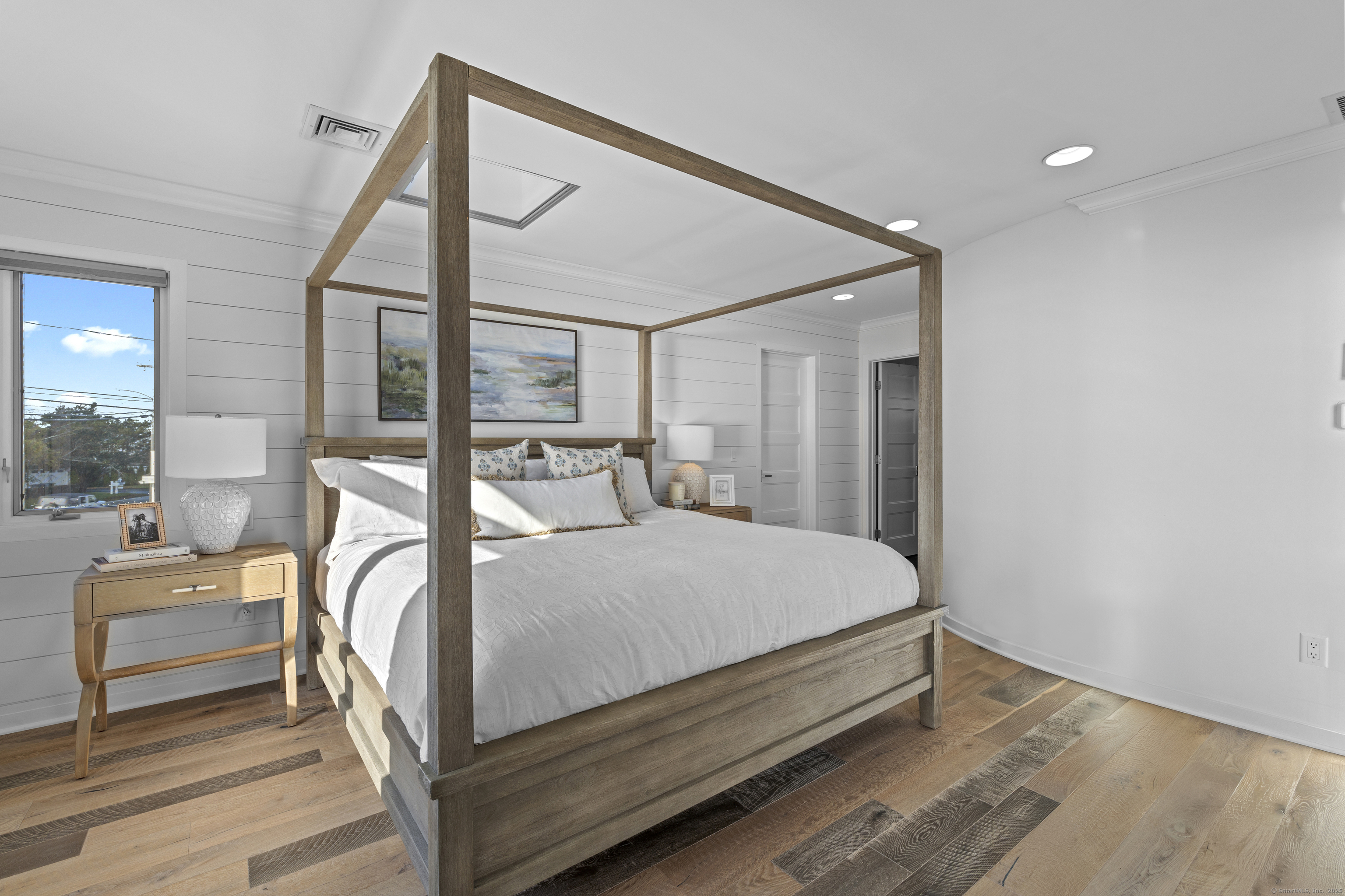 372 Maple Avenue Old Saybrook, CT 06475 - Photo 23 of 40 a bed sitting in a bedroom next to a window