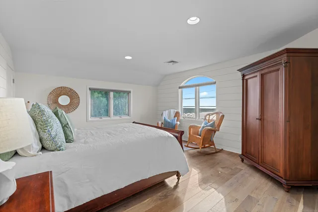 a bed room with a bed and a window