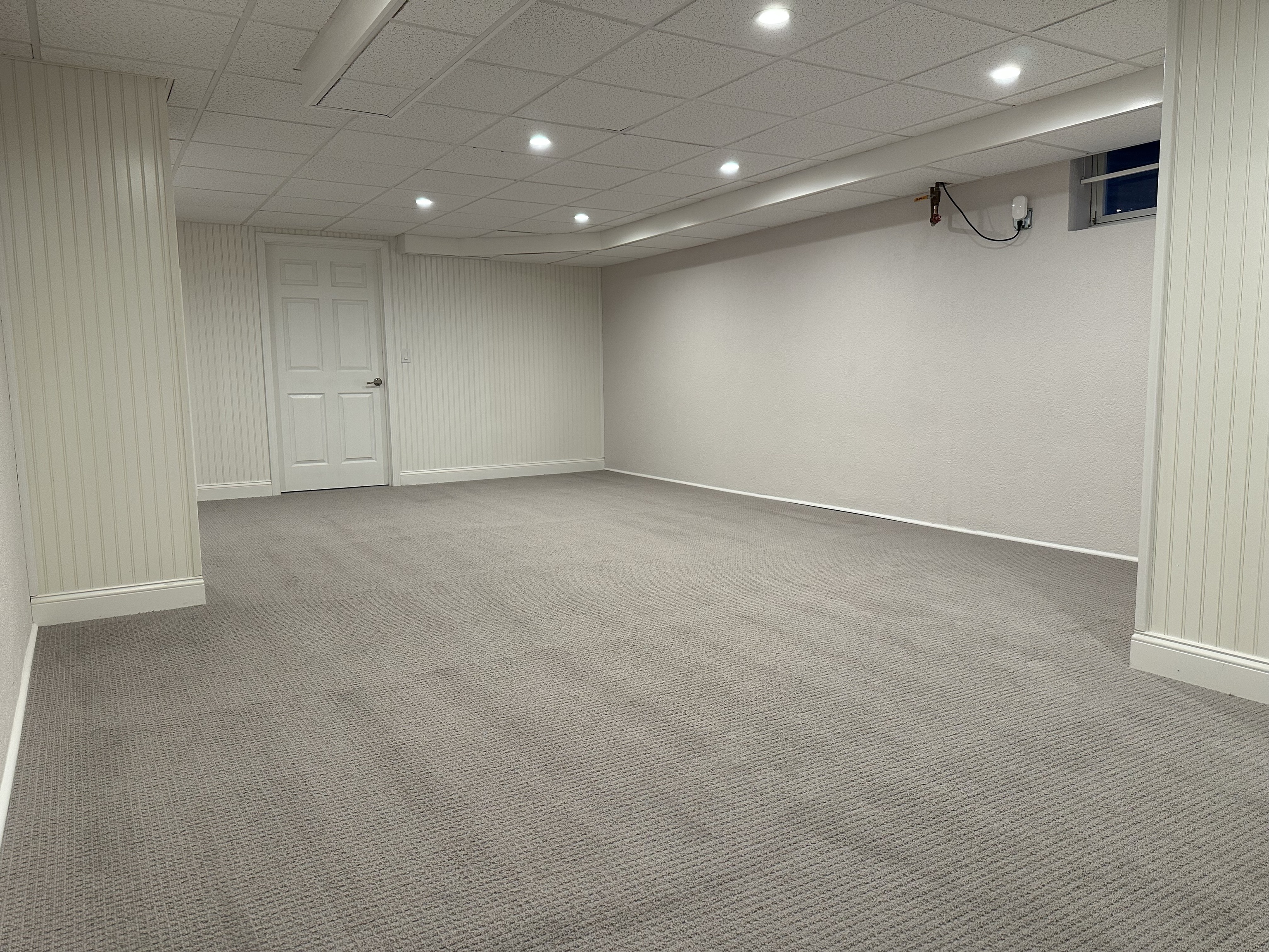 372 Maple Avenue Old Saybrook, CT 06475 - Photo 36 of 40 an empty room with a cabinet and mirrors