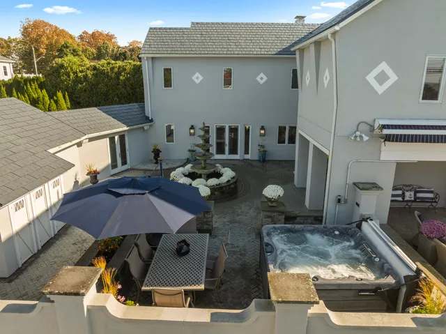 a aerial view of a house with swimming pool and porch