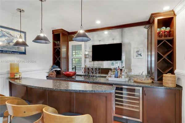 a kitchen with a sink stove and refrigerator