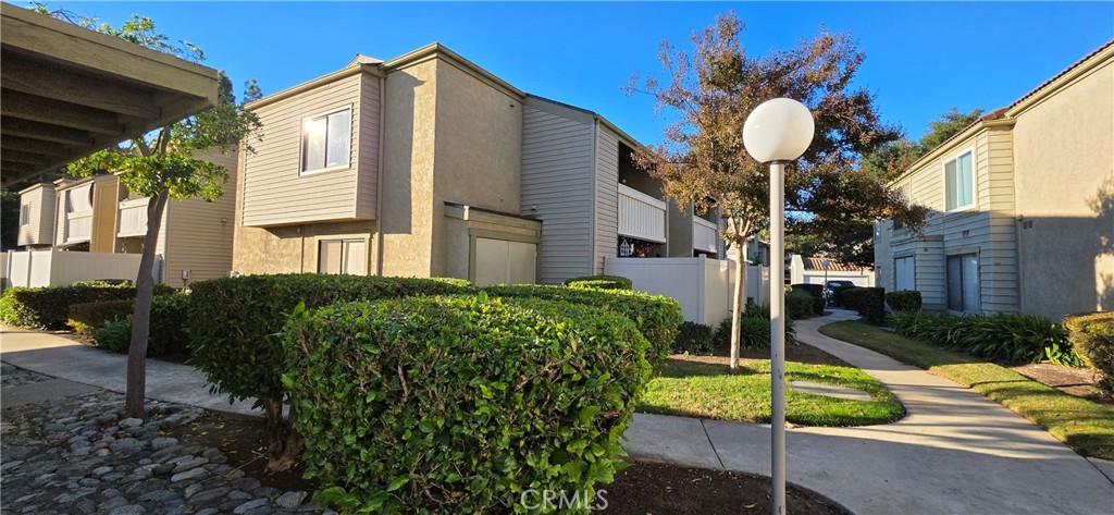 46 Town And Country Road Phillips Ranch, CA 91766 - Photo 1 of 37 a backyard of a house with table and chairs