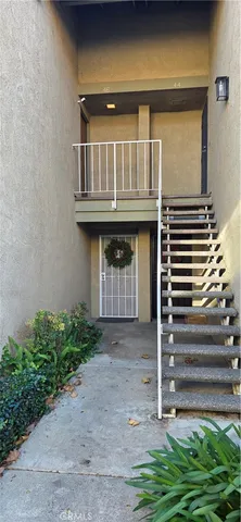 a view of house with backyard and porch