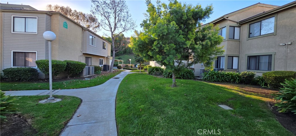 46 Town And Country Road Phillips Ranch, CA 91766 - Photo 24 of 37 a front view of a house with garden