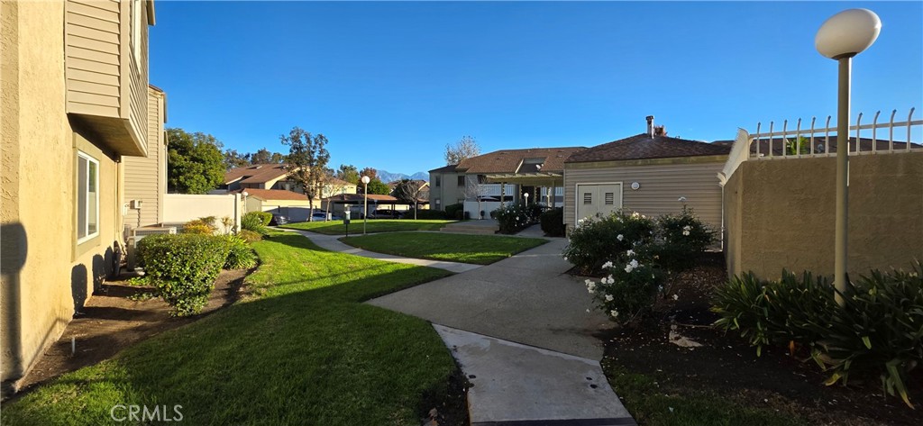 46 Town And Country Road Phillips Ranch, CA 91766 - Photo 25 of 37 a view of a house with a yard and potted plants