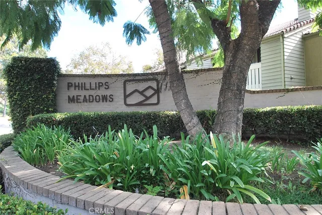 a view of a car parked in front of a yard