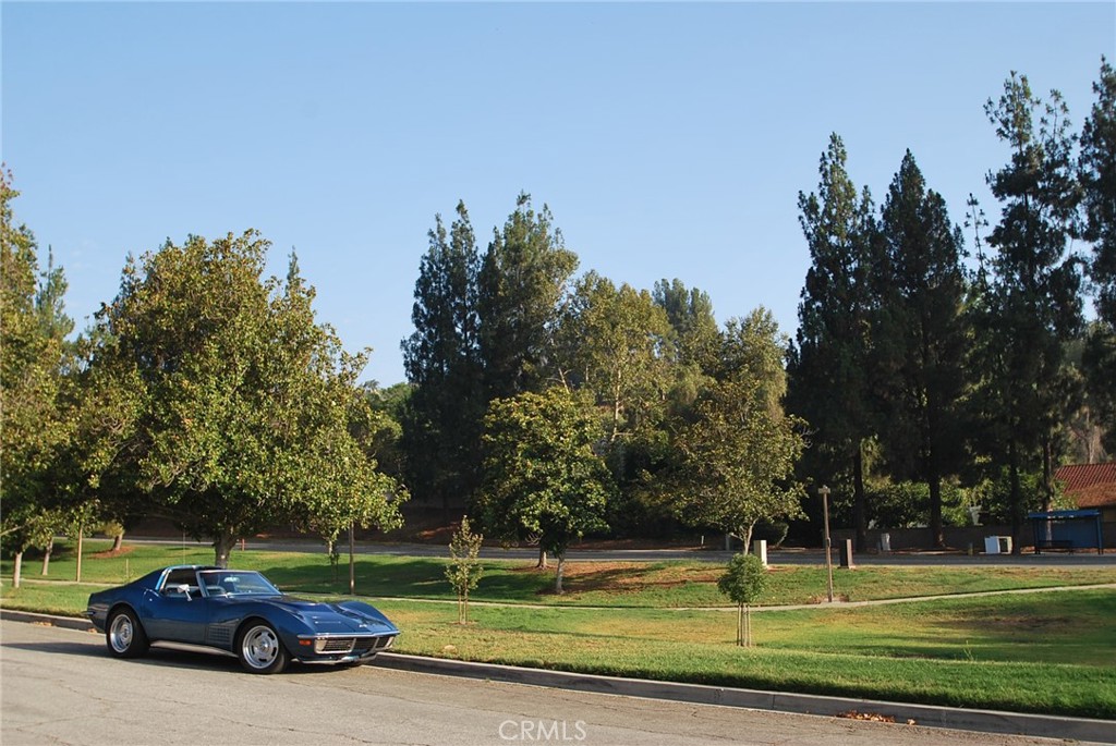 46 Town And Country Road Phillips Ranch, CA 91766 - Photo 28 of 37 a view of a car parked in front of a yard