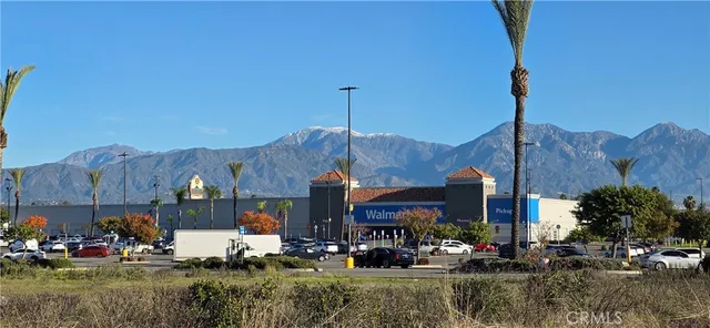 a front view of a building with small garden