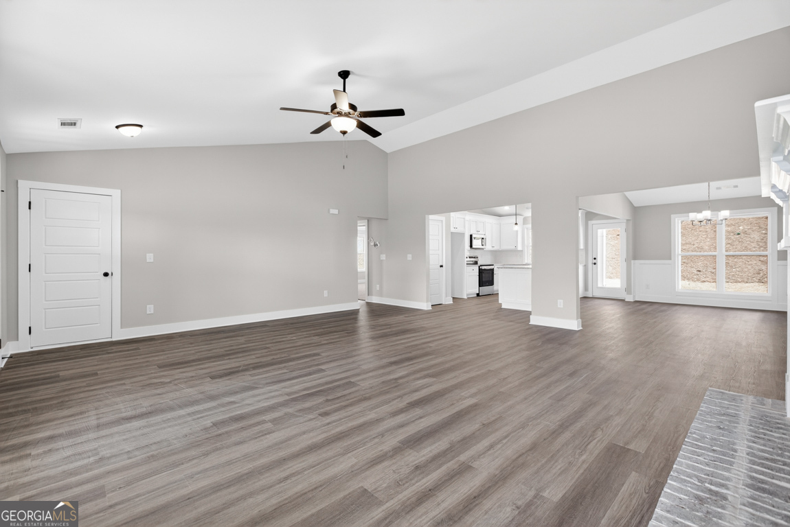 97 Wards Creek Road, Unit 1 Toccoa, GA 30577 - Photo 9 of 55 a view of an empty room with a window and wooden floor