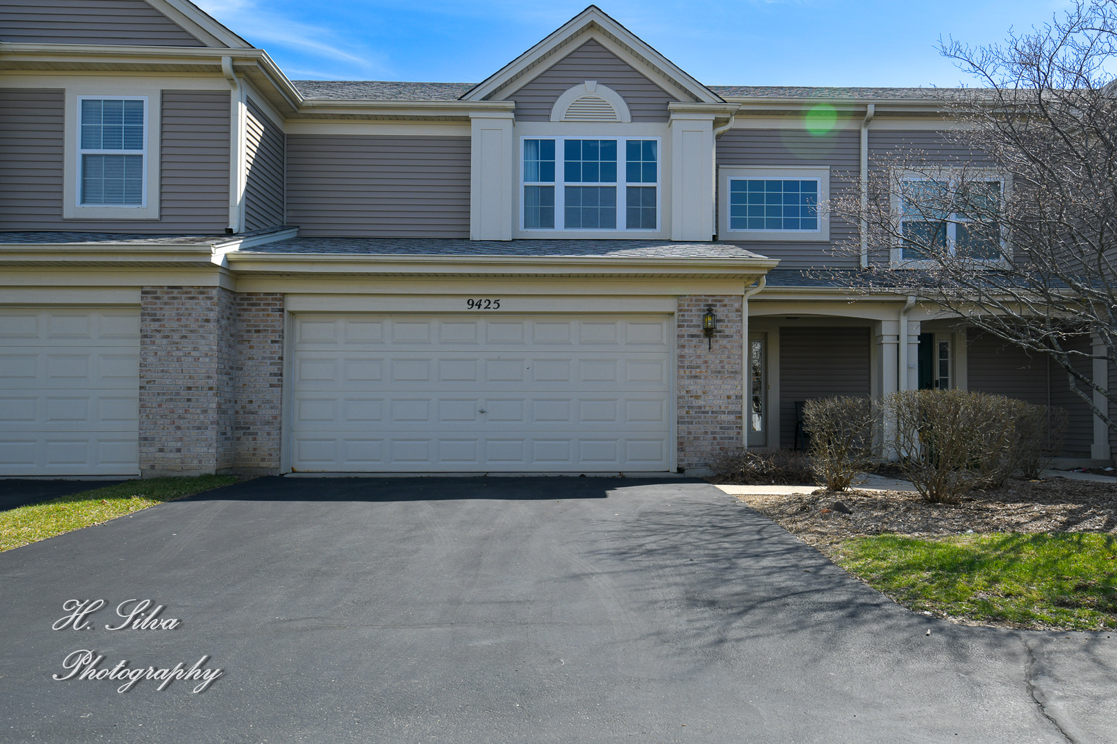 9425 Rainsford Drive Huntley, IL 60142 - Photo 1 of 15 a front view of a house with a yard and garage