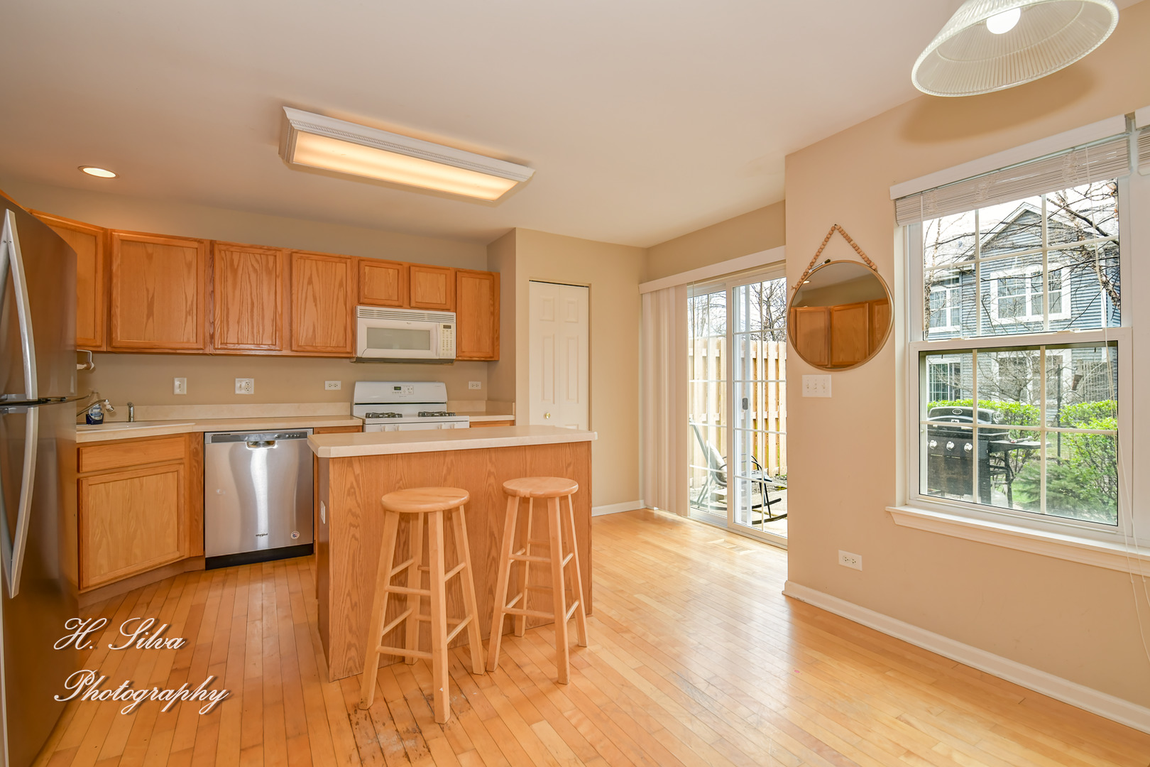 9425 Rainsford Drive Huntley, IL 60142 - Photo 2 of 15 a kitchen with stainless steel appliances granite countertop a stove a sink and a microwave