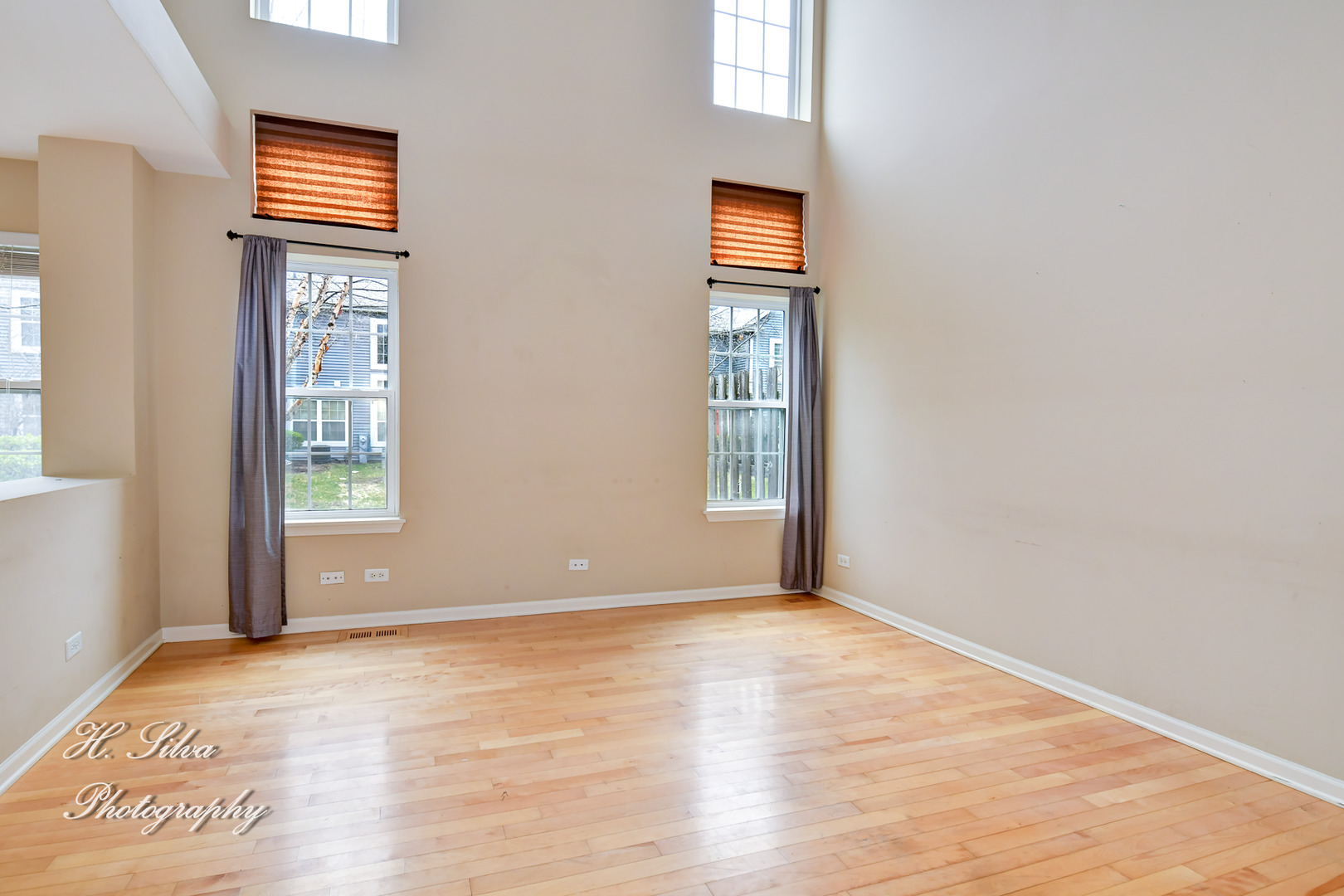 9425 Rainsford Drive Huntley, IL 60142 - Photo 6 of 15 a view of an empty room with window and wooden floor