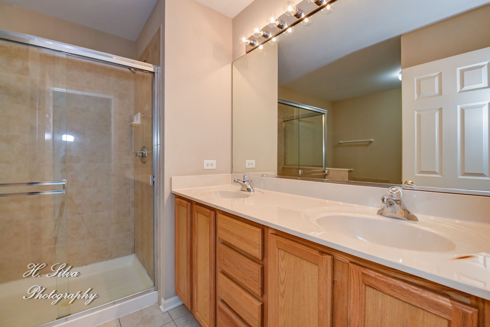 9425 Rainsford Drive Huntley, IL 60142 - Photo 10 of 15 a bathroom with a double vanity sink and mirror