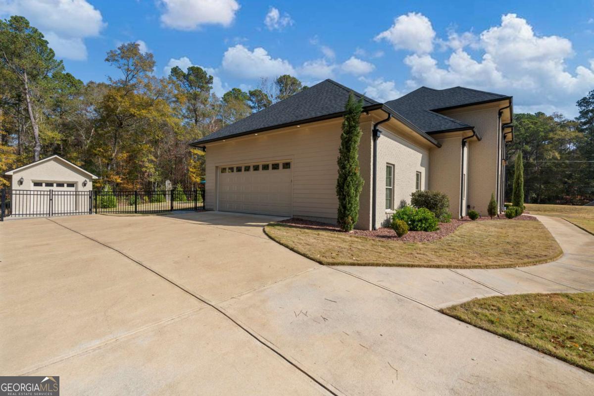 8904 Lilly Rock Way Midland, GA 31820 - Photo 41 of 49 a view of a house with a snow on the road