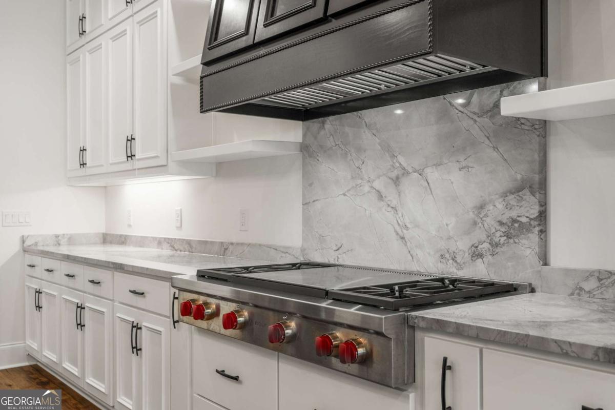 8904 Lilly Rock Way Midland, GA 31820 - Photo 8 of 49 a stove top oven sitting inside of a kitchen