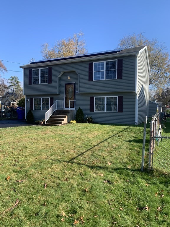 111 Warrenton Street Springfield, MA 01109 - Photo 1 of 18 a front view of a house with a yard