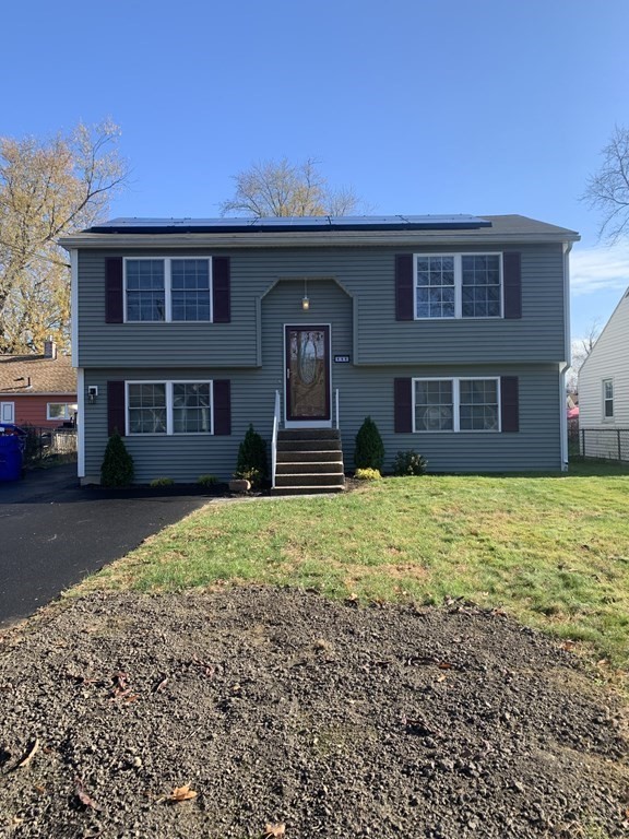 111 Warrenton Street Springfield, MA 01109 - Photo 2 of 18 a front view of a house with a yard