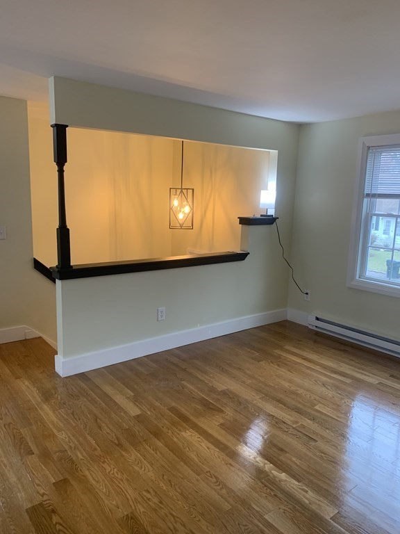 111 Warrenton Street Springfield, MA 01109 - Photo 7 of 18 a view of empty room with wooden floor and fan