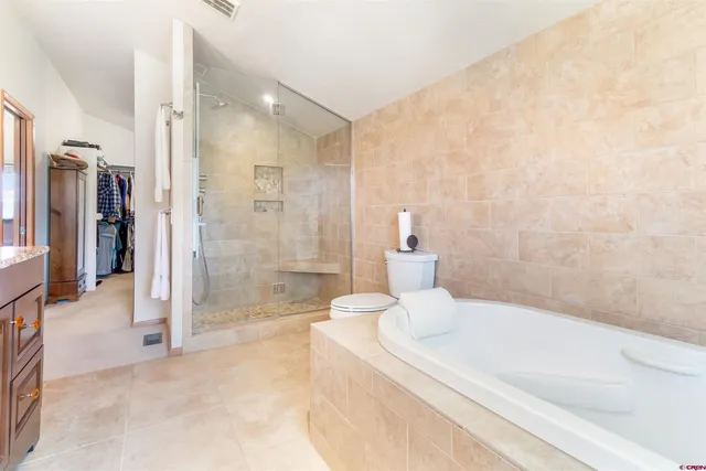 a bathroom with a bathtub and a shower