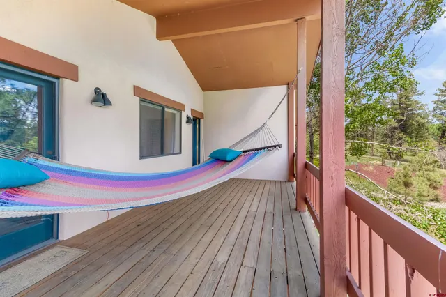 a view of balcony with wooden floor