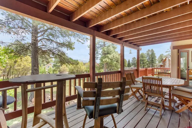 a view of a patio with wooden floor