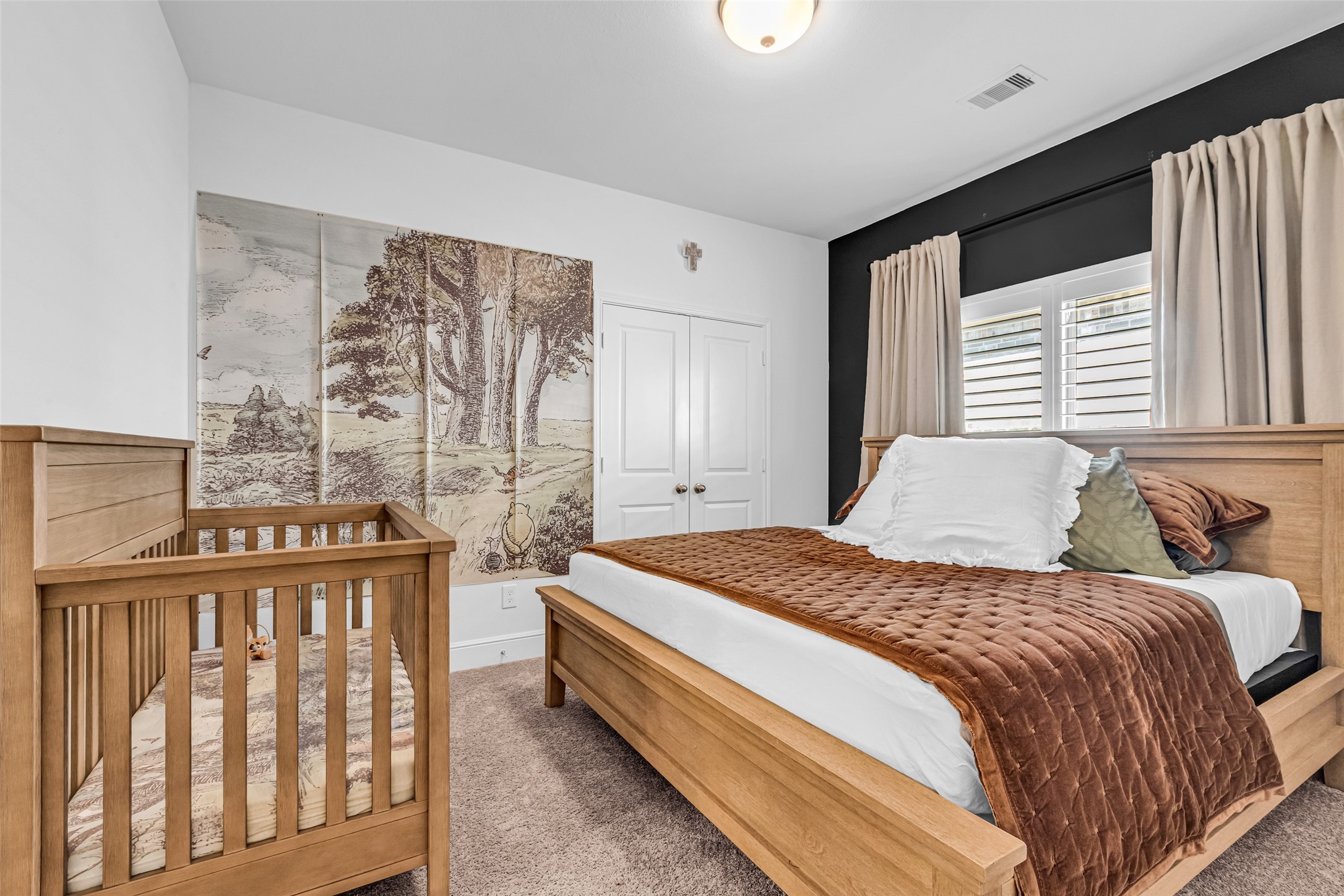 423 Bartlett Street Webster, TX 77598 - Photo 21 of 26 a bedroom with a bed and a window