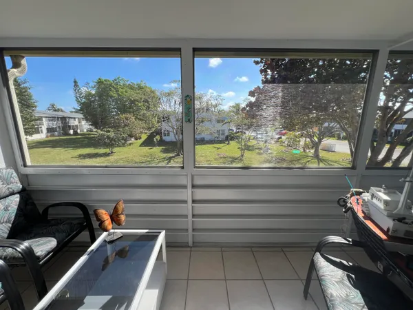 a view of a floor to ceiling window and an outdoor space