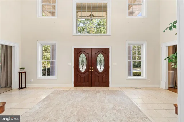 a view of a dining room with furniture wooden floor and chandelier