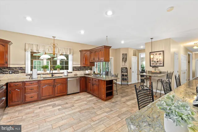 a bathroom with a sink a toilet a shower and a mirror