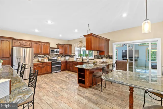 a spacious bedroom with a bed and a fireplace