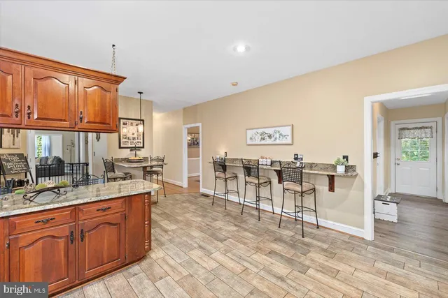 a bathroom with bathtub and window
